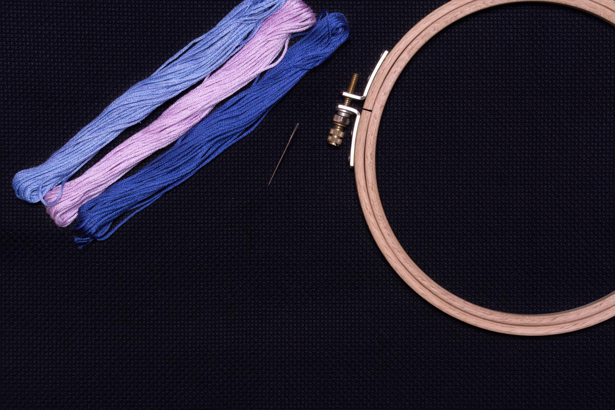 Worn unfinished embroidery with uneven stitches